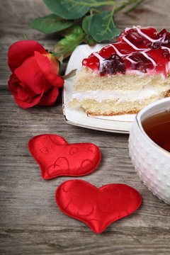 Cup of tea, piece of cake and red heart
