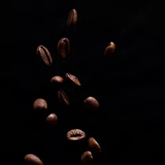 Fotobehang High contrast image of coffee beans being dropped onto pile with © robdthepastrychef