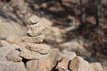 Stone cairn on a blurry background