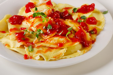 Italian homemade ravioli pasta with a tomato sauce
