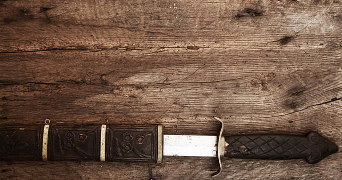 Broad Sword On Wooden Background