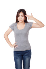 Fototapeta premium Young Asian woman gesturing gun to head