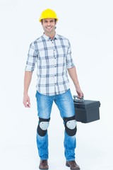 Male technician carrying tool box