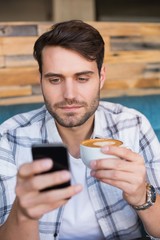 Young man having cup of coffee