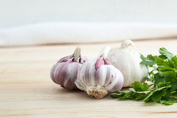 Composition of purple garlic with parsley