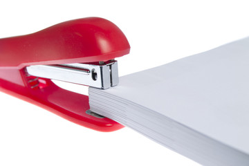 red stapler and paper