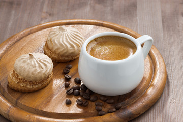 cup of espresso and cookies on wooden tray