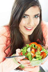 Young woman eat salad. Healthy vegetarian food.