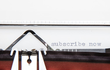 Typwriter showing the term subscribe now.