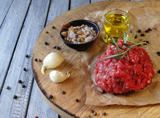 Raw ground beef for burgers cooking with spices - obrazy, fototapety, plakaty