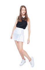 Young fashion girl in white skirt posing isolated