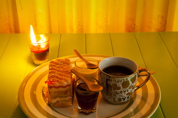 cup of coffee and delicious orange cake