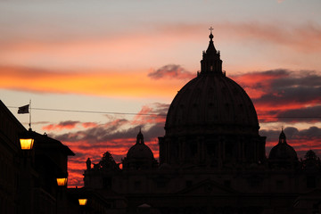 Sunset over the dome of Saint Peter's Basilica in Vatican City i