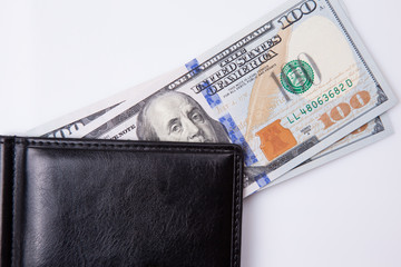 purse with hundred dollar banknotes