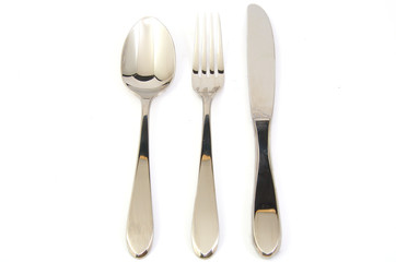 Metal fork, spoon and knife on white background.