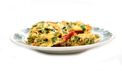 Vegetable omelet with eggs on a plate. Photo.