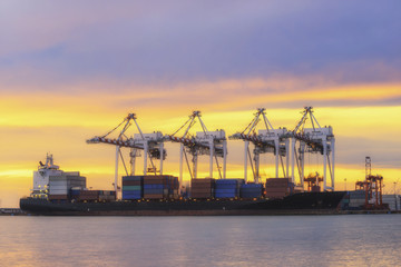 Fototapeta na wymiar Container Cargo freight ship with working crane loading 