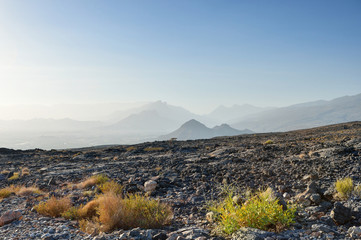 Silhouettes of the mountains with rocky foreground, Oman