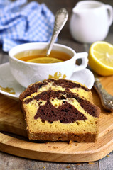 Pumpkin and chocolate cake with cup of tea.
