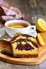 Pumpkin and chocolate cake with cup of tea.