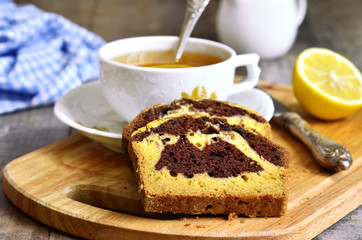 Pumpkin and chocolate cake with cup of tea.