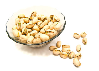 plate with tasty pistachios closeup