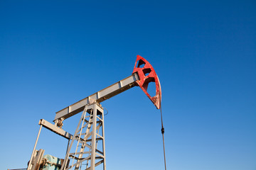 part of the oil pump closeup on blue sky background
