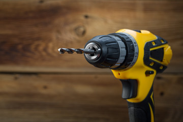 electric drill on a wooden background