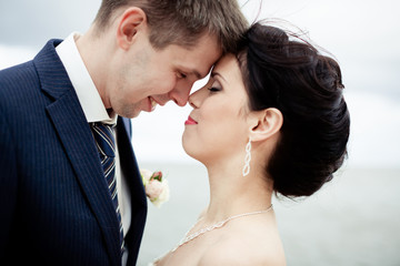 Happy bride and groom on their wedding. High key blurred image