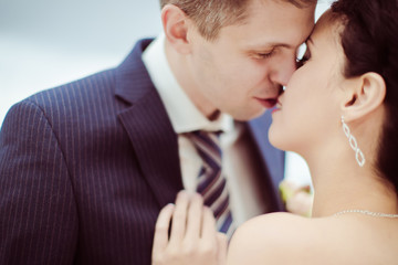 Happy bride and groom on their wedding. High key blurred image