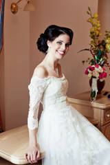 Romantic rich happy girl in bridal dress 