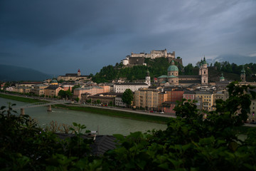 Salzburg r with dramatic cloudscape during blue hour, Austria
