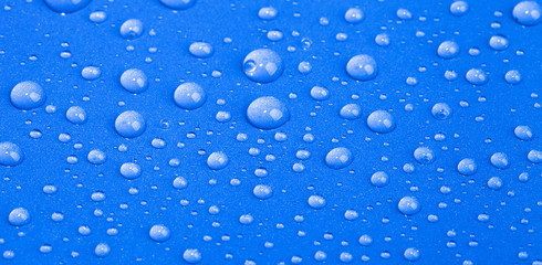 Drops of water on the colored background