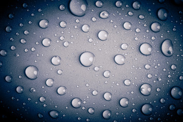 Drops of water on the colored background