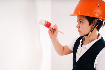 boy paints the wall