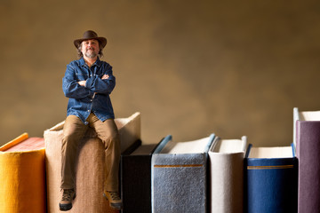 man sitting on the books