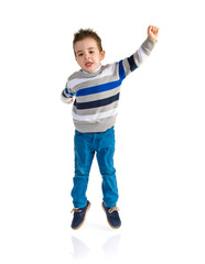 Kid jumping over white background