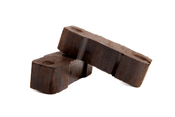 zwei Briketts Braunkohle