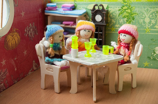 dolls at the table