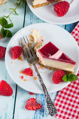 Raspberry cake with fresh fruits on rustic table