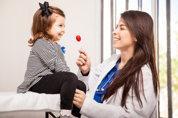 Pediatrician giving a lollipop