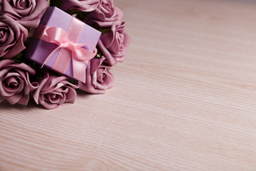 Purple roses and gift box