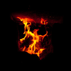Flames erupt from the combustion chamber of the furnace