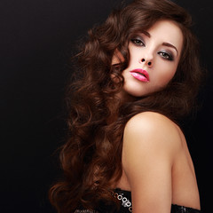 Naklejka premium Beautiful makeup woman with curly hair looking