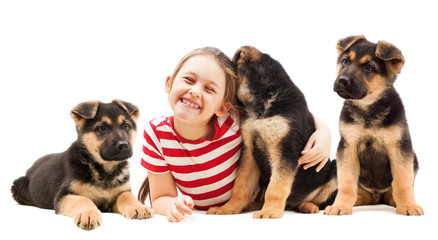 girl hugging a puppy