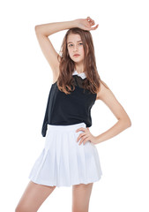 Young fashion girl in white skirt posing isolated