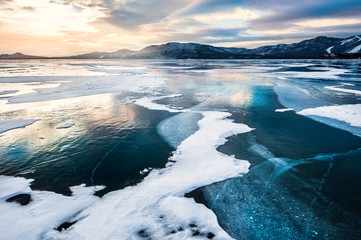 Fantastic winter landscape with frozen lake