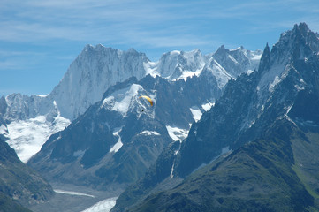 Paraglider and peaks nearby Chamonix in Alps in France