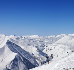Fototapeta na wymiar Ski resort at sun winter day