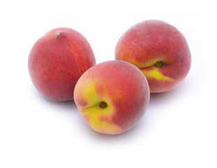 fresh peaches on white background